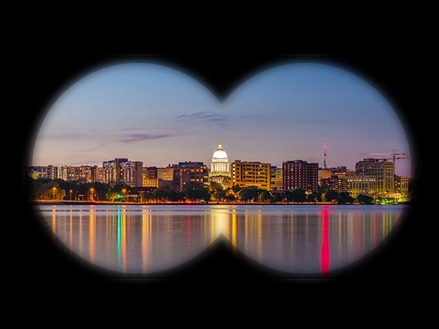 A view of the downtown Madison skyline through binoculars.